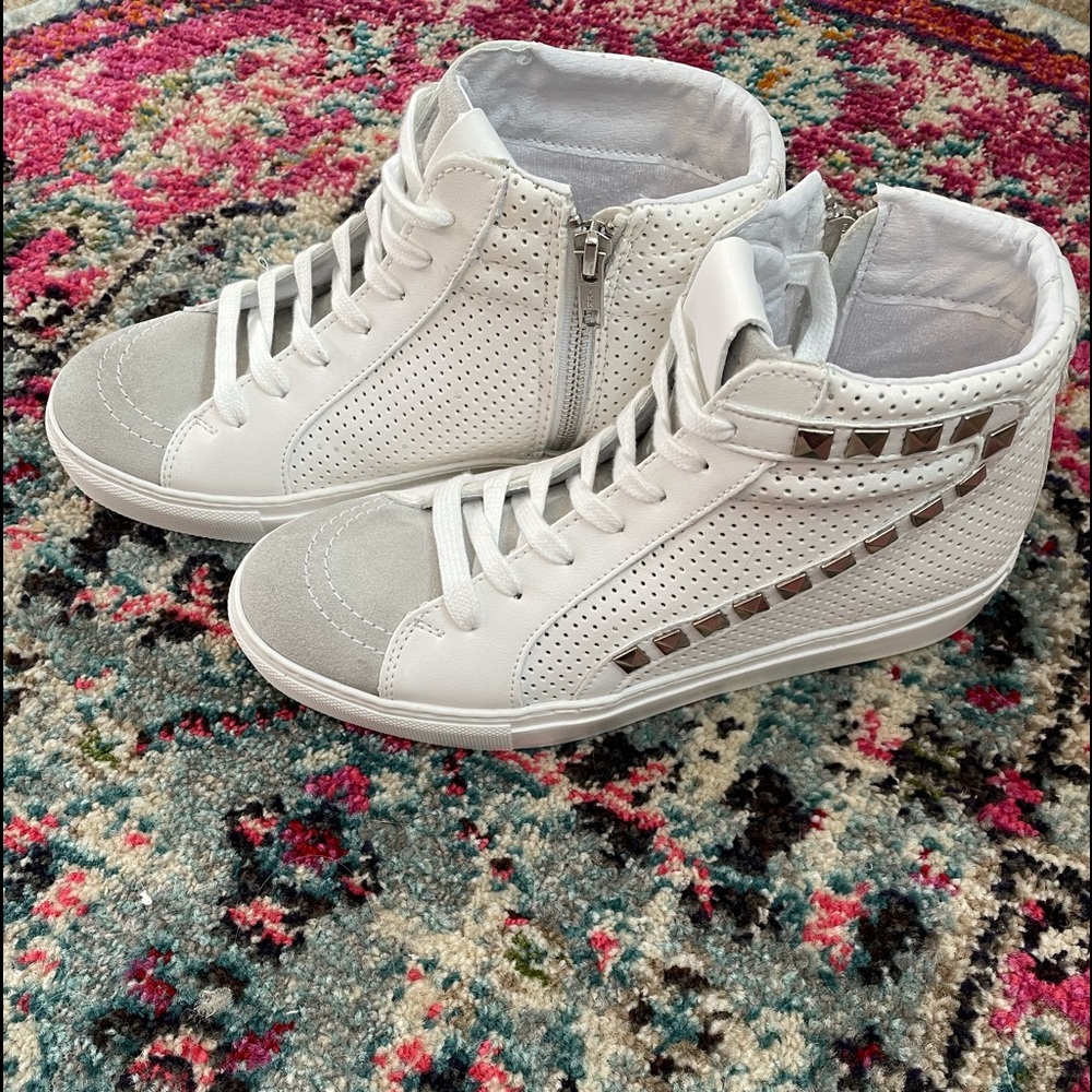 White/grey studded outer side with inside zipper